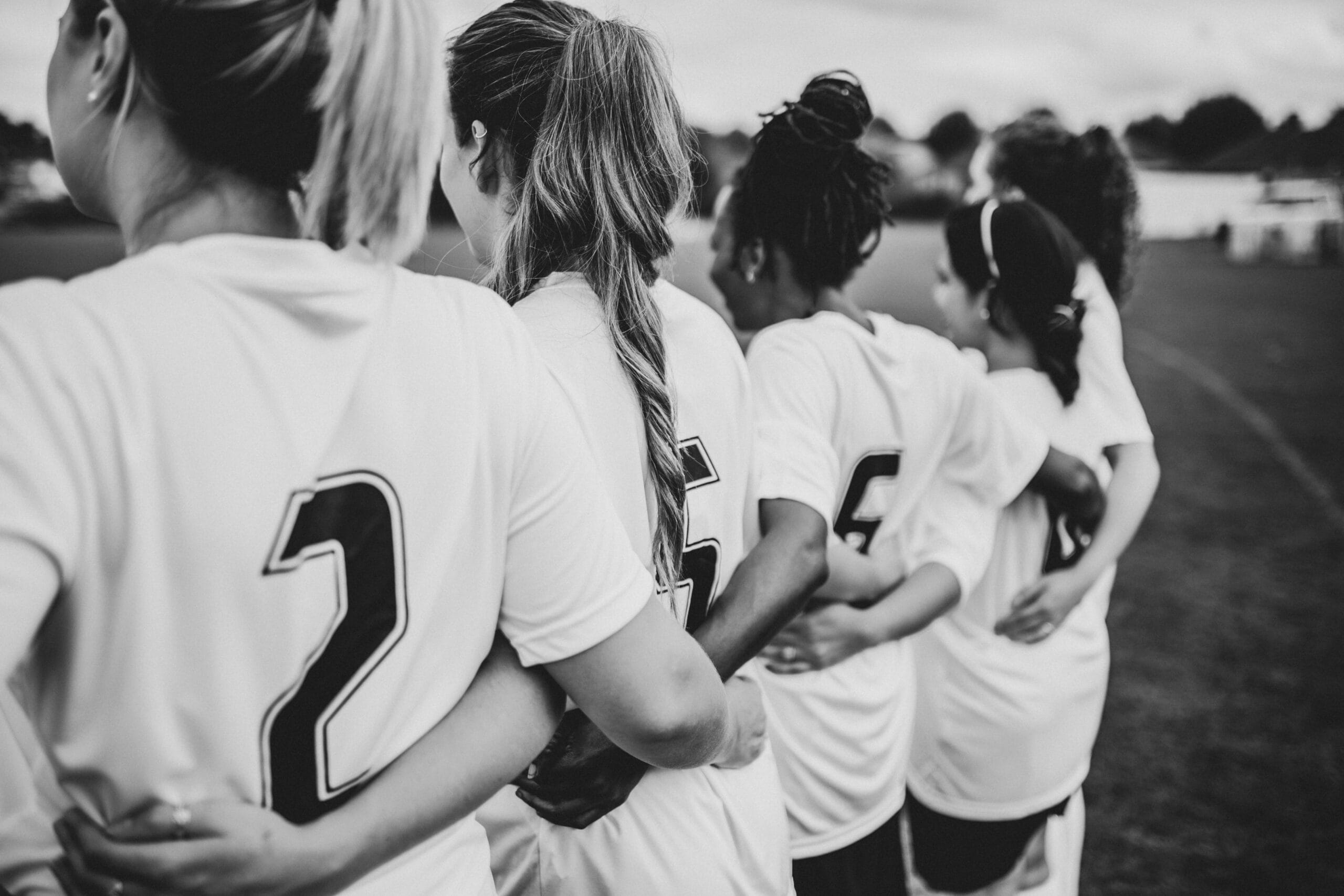 Athletes having a supportive team conversation